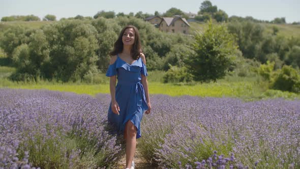 Stunning Woman Walking Through Blooming Field