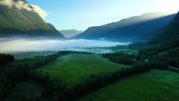 Morning Mist Over the Valley Among the Mountains in the Sunlight