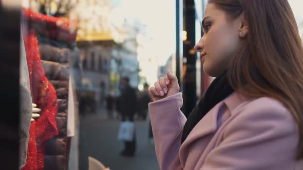 Sad Girl Looking in Shop Window, Dreaming of Expensive Dress, Sales and Discount