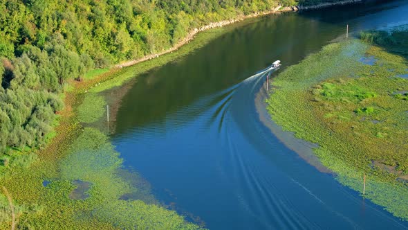 Tourist boat on river Rijeka Crnojevica in Montenegro