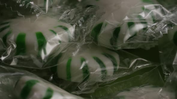 Rotating shot of spearmint hard candies - CANDY SPEARMINT 011
