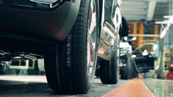 Bottom View of a Car at a Car Production Conveyor. Close Up