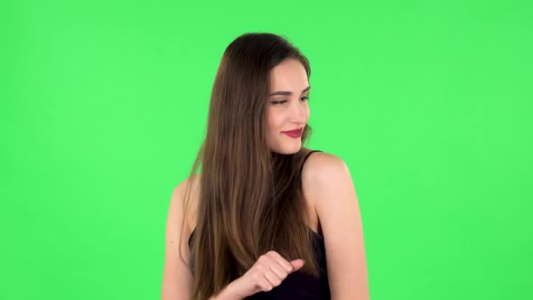 Girl Is Dancing on a Green Screen in the Studio