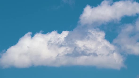 Time Lapse Footage of Fast Moving White Puffy Cumulus Clouds on Blue Clear Sky