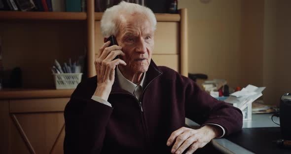 Senior Man Talking on Mobile Phone