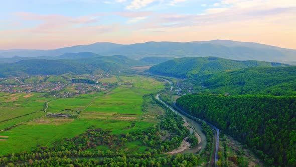 Drone Flies Above Countryside Landscape in Spring