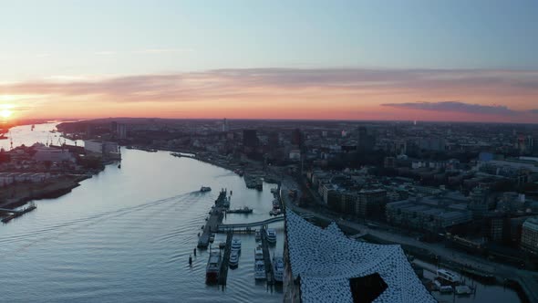 Aerial View of Modern Buildings in Hamburg City Center on the Banks of Elbe River During Sunset