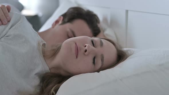 Attractive Couple Feeling Restless While Sleeping in Bed