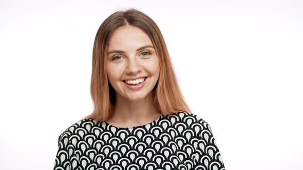 Young Beautiful Blonde Girl Smiling Over White Background