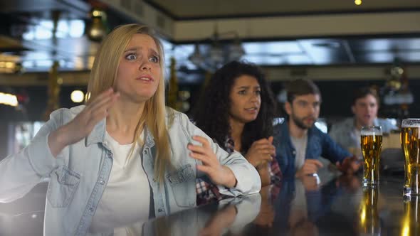 Young Sport Fans Watching Match in Bar, Upset About Losing, Spoiled Weekend