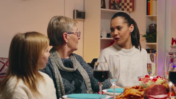 Grandmother Talking with Her Daughter and Granddaughter