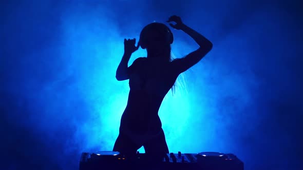 Silhouette of Girl DJ in the Smoke, Slow Motion