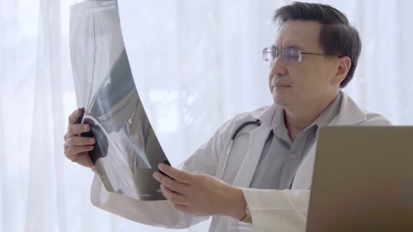 Doctor Working with Patient Health Data in the Hospital Office