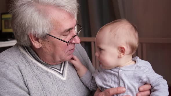 Family Relations of Elderly Male and Crying Baby Girl