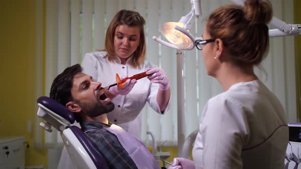 Client During Process of Dental Filling at Dentist