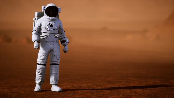 Astronaut on Mars Surface. Red Planet Covered in Gas and Rock