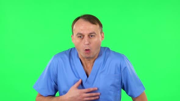 Medical Man Feels Bad, Her Stomach Hurts, Feeling Nausea. Green Screen