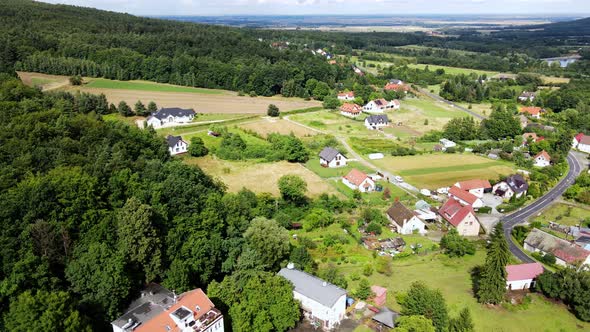 Village in Mountains with Forest Aerial View