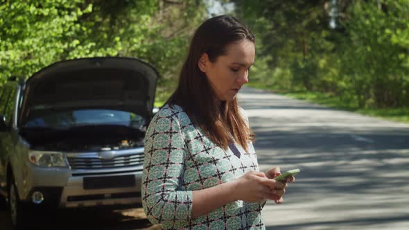 Portrait of Concerned Woman Having Car Incident in Countryside