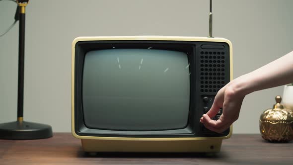 Turning on Old Retro Television with Antenna on Grey Background Channel Setting