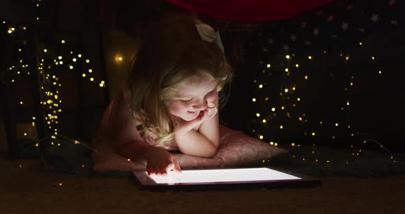 Caucasian mother and daughter having fun using digital tablet