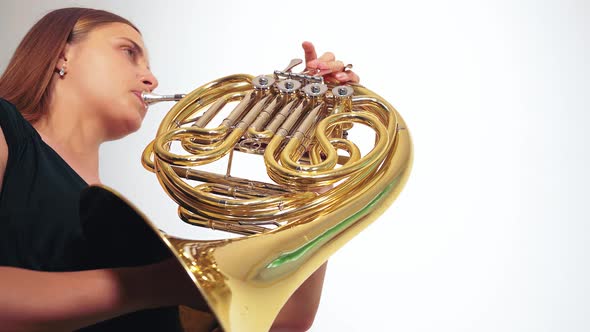 Young Beautiful Plays the French Horn