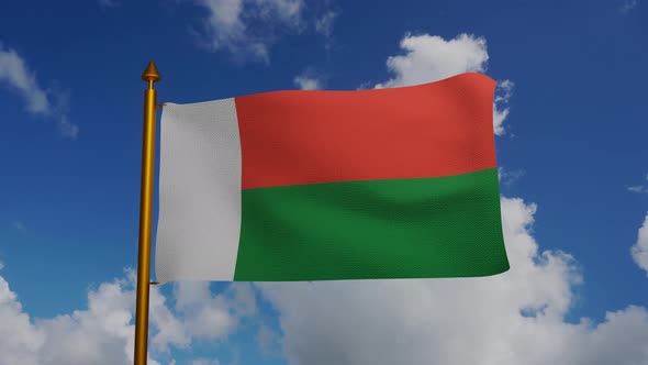 National flag of Madagascar waving with flagpole and blue sky timelapse