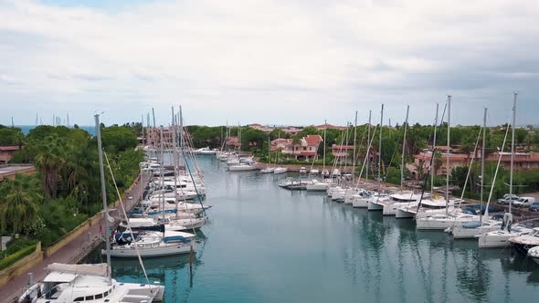 Aerial View on Moored White Sailing Boats at Marina Portorosa, Furnari, Italy. Mediterranean Sea and