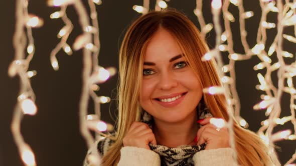 Cute Women in Front of Christmas Lights