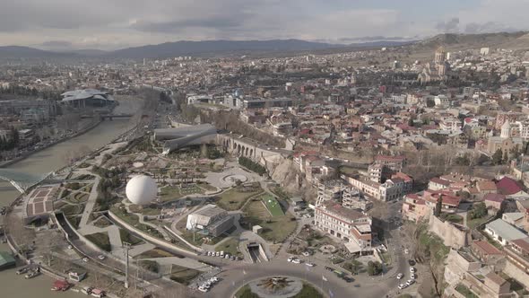 Aerial view of Tbilisi city central park and Bridge of Peace. Beautiful cityscape of old Tbilisi