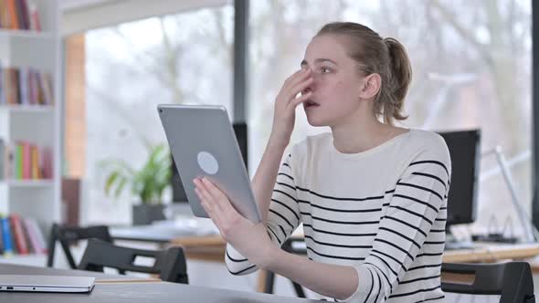 Failure, Young Woman with Loss on Tablet in Library 