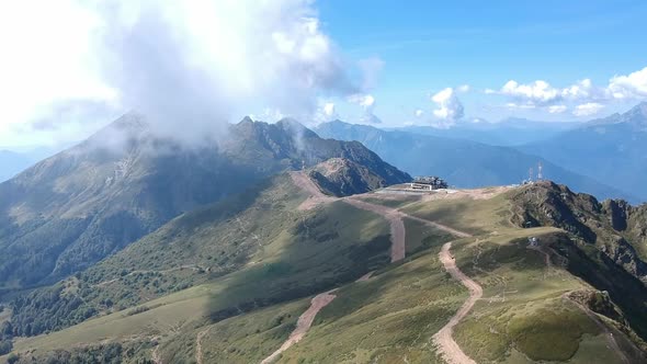 Aerial View of the Mountains in the Alps Meadows and Fields