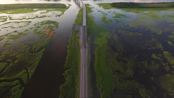 Flying backwards over causeway in Ocean Isle Beach NC at sunset