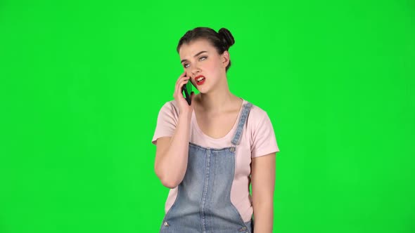 Girl Angrily Speaks on the Phone, Proves Something on Green Screen