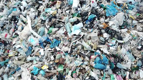 Garbage in the canals after the flood. Contaminated rivers with plastic waste.