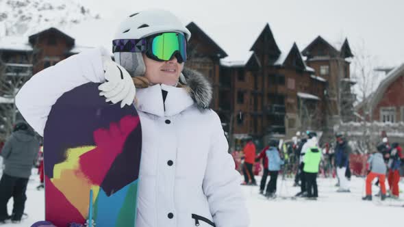 Woman Enjoying Leisure Time After Riding Down Mountain on Snowboard Aspen Resort