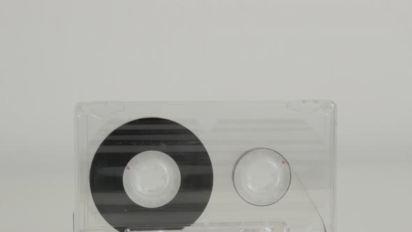 Transparent analogue  magnetic tape 4K 2160p 30fps UltraHD tilting footage - Compact  audio cassette