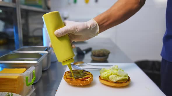 Process making of burger. Chef making beef burgers indoor at restaurant kitchen