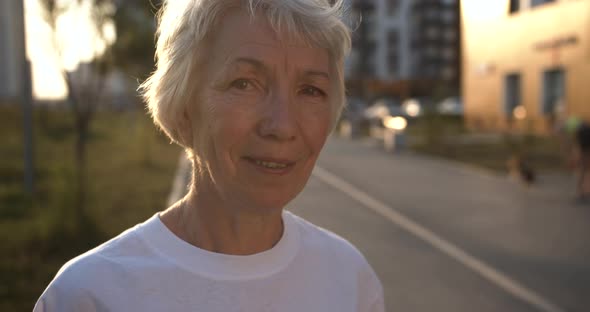 Portrait of an Elderly Modern Woman at Sunset
