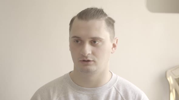 Portrait of Brunette Brown-eyed Man Talking with Someone and Looking at Camera. Young Caucasian Guy