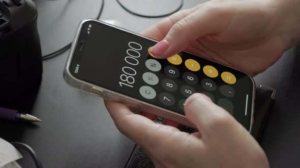 phone is in women's hands, the girl uses the smartphones typing on the screen