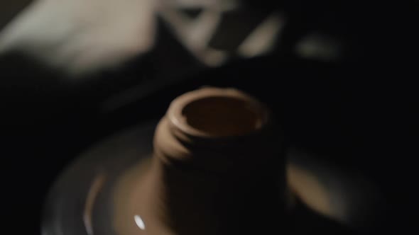 Artisan Male Hands Shaping and Cutting Jug From a Clay on a Potter's Wheel