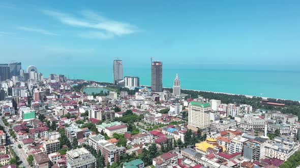 Aerial view of beautiful lake in the center of Batumi. flying over 6 May park. Georgia 2022 summer