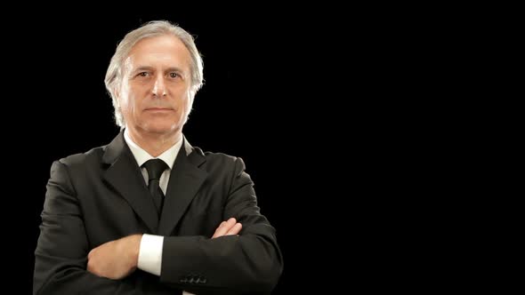 Middle Age Elegant Businessman Gesturing Isolated on Black