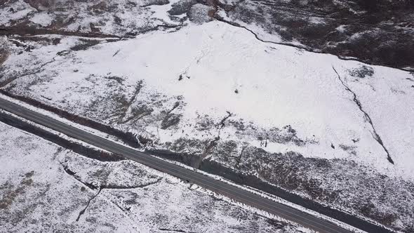 AERIALS of Snowy landscape in Lesotho, Africa - Snow fall in Africa Car driving on roads in snowy l