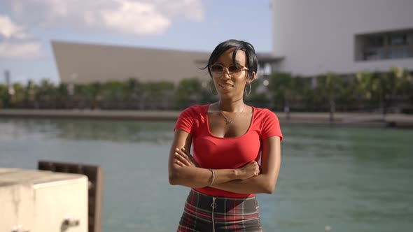 Push In Shot Attractive Young Woman Smiling At Camera. Woman Wearing Sunglasses