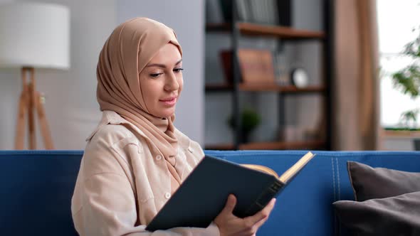 Beautiful Muslim Woman in Hijab Reading Interesting Paper Book Koran Traditional Islam Literature alt