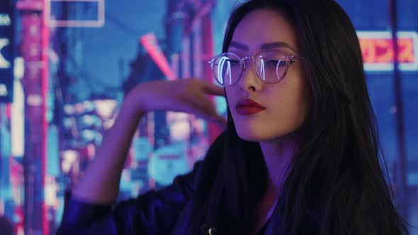 Asian Woman in the City at Night
