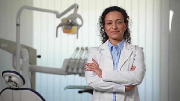 Smiling Female Stomatologist in Dental Office