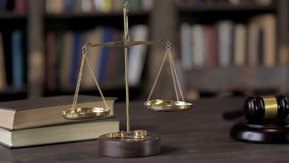 Gold Brass Balance Scale on Judge Wooden Table